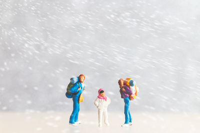 High angle view of figurines on snow