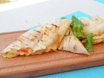 Close-up of serving food on cutting board