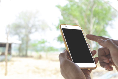 Close-up of hand holding smart phone