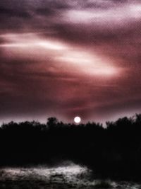Scenic view of silhouette trees against sky at sunset