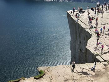 High angle view of people at preikestolen on sunny day