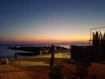 Scenic view of beach against sky during sunset