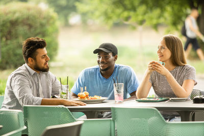 Young men sitting on table