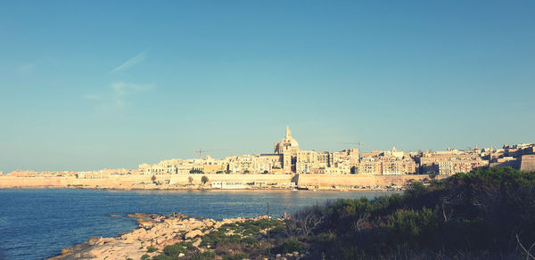 View of buildings against blue sky