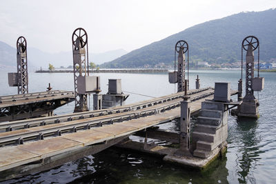 Pier over river against sky