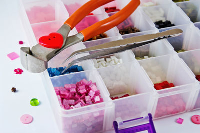 High angle view of multi colored candies in container