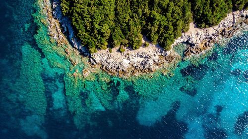 High angle view of rock formation in sea