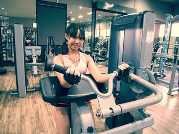 Portrait of girl exercising in gym