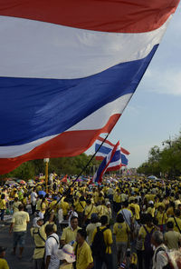 Crowd protesting on street in city