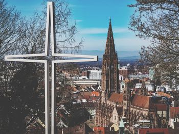 Panoramic view of buildings and trees against sky