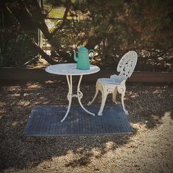 High angle view of empty chair on table