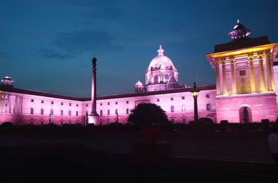 View of illuminated building against sky at night