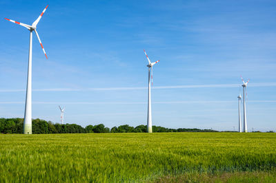 Wind turbines in a grain field seen in germany