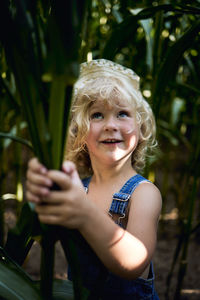 Portrait of smiling boy standing outdoors