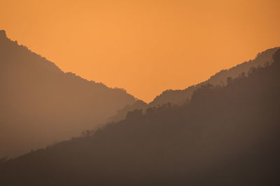 Scenic view of mountains against sky during sunset