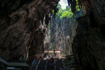 People walking in cave