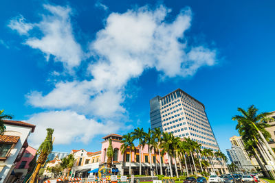 Low angle view of buildings against blue sky