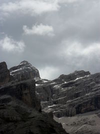 Scenic view of mountains against cloudy sky
