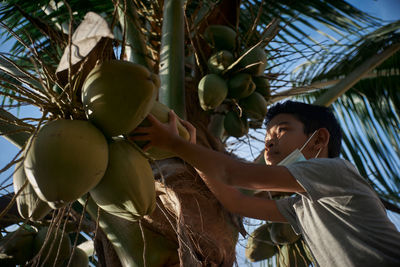 Midsection of woman holding fruit