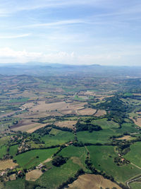 Aerial view of agricultural field against sky