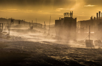 Panoramic view of buildings in city during sunset