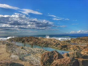 Scenic view of sea against blue sky