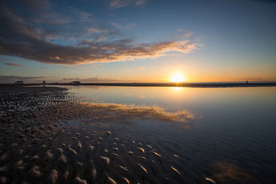 Scenic view of sea against sky during sunset