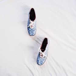 High angle view of shoes on white cloth