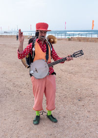 Full length of a man standing on beach