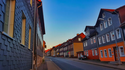 Street amidst buildings against sky