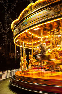 Illuminated ferris wheel at night