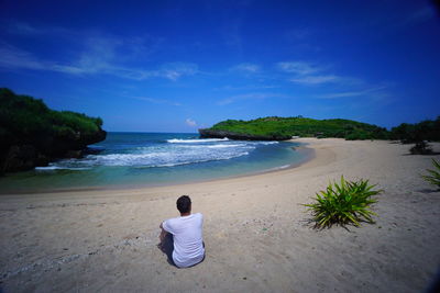 Rear view of woman on beach