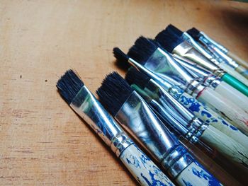 High angle view of paintbrushes on table