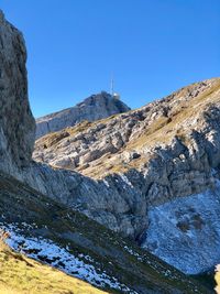 Scenic view of mountains against clear blue sky