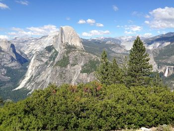 Scenic view of mountains against cloudy sky