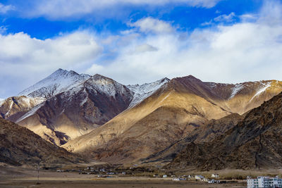 Scenic view of snowcapped mountains against sky