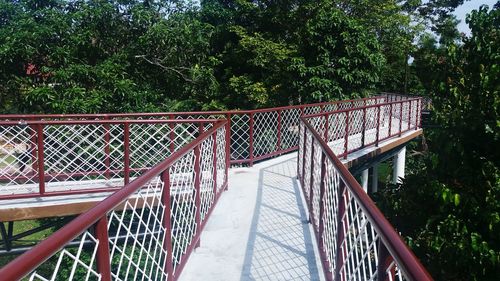 Footbridge against trees