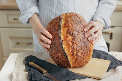 Midsection of man preparing food