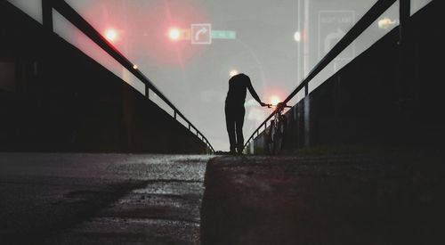 Silhouette woman walking on staircase