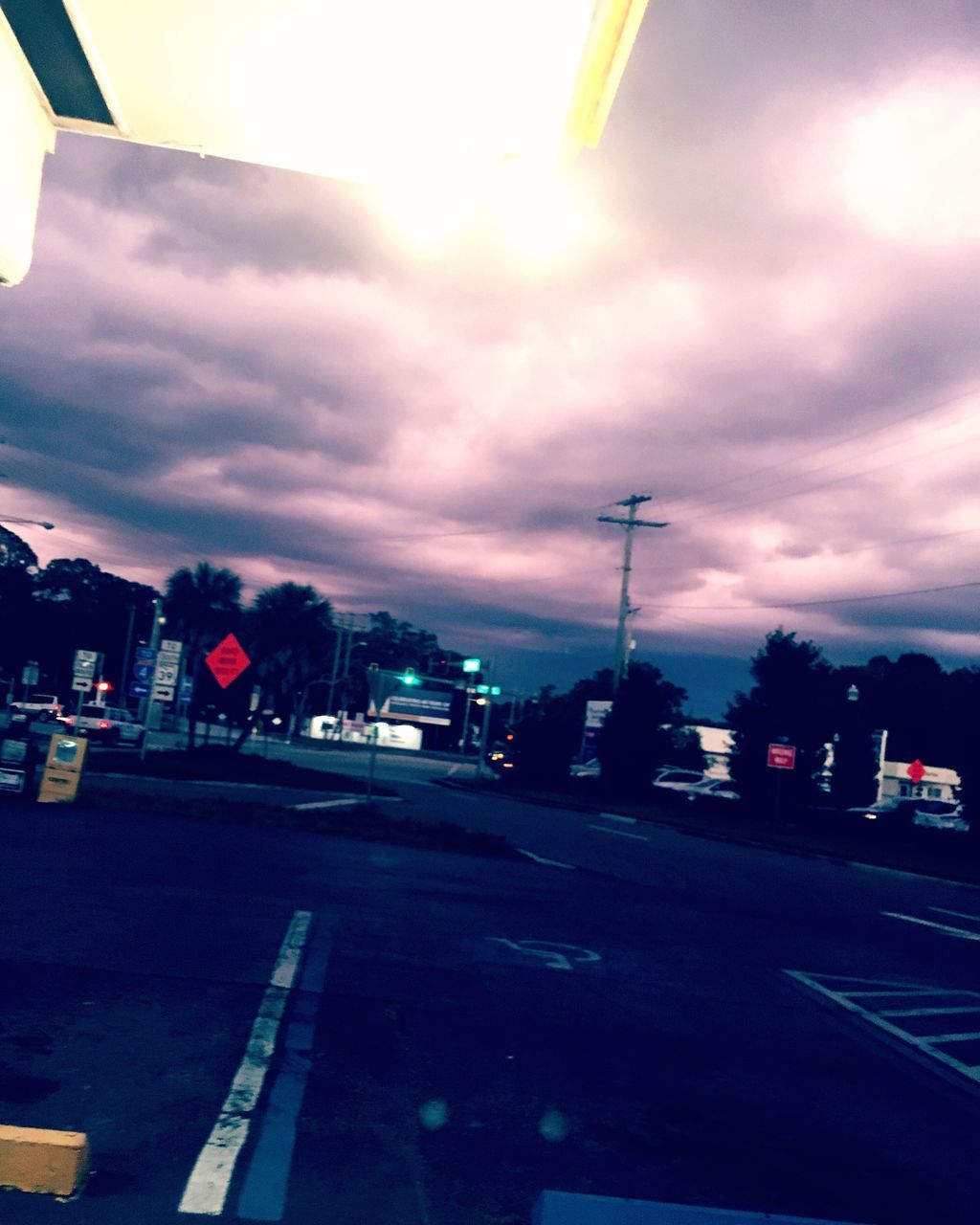 road, transportation, sky, cloud - sky, car, sunset, street, city, outdoors, built structure, city life, land vehicle, building exterior, no people, illuminated, architecture, street light, day, nature