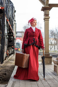 Rear view of woman using mobile phone