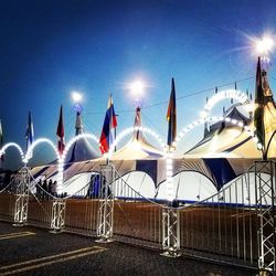 Panoramic view of illuminated lights against sky