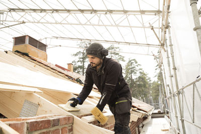 Bricklayer working on construction site