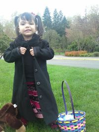 Man standing on grassy field in park