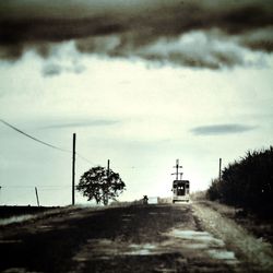 View of road against cloudy sky