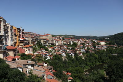 High angle view of townscape against clear blue sky