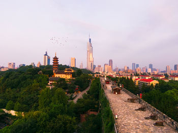 Panoramic view of buildings in city against sky