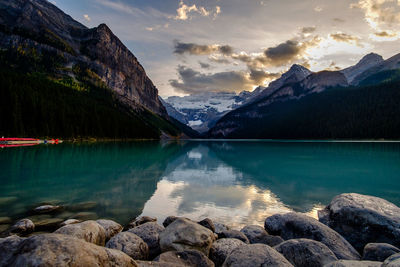 Scenic view of lake and mountains against sky