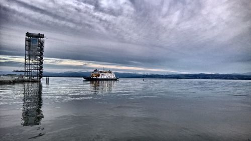 Scenic view of sea against cloudy sky