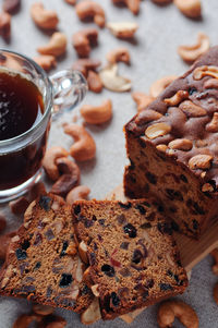 Sliced fruit cake with a cup of coffee